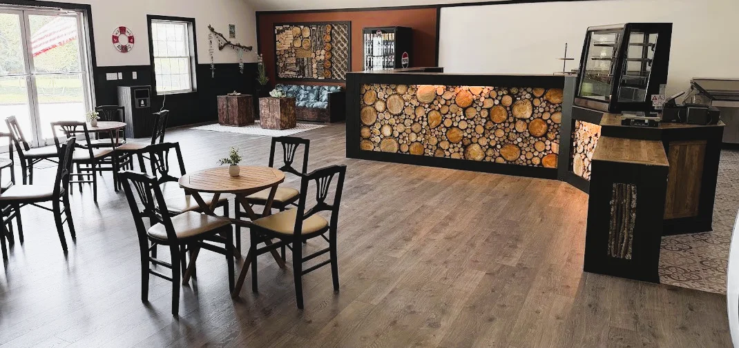 Interior of Acadia Flatbread in Ellsworth, emphasizing the rustic design and handcrafted wooden furniture 