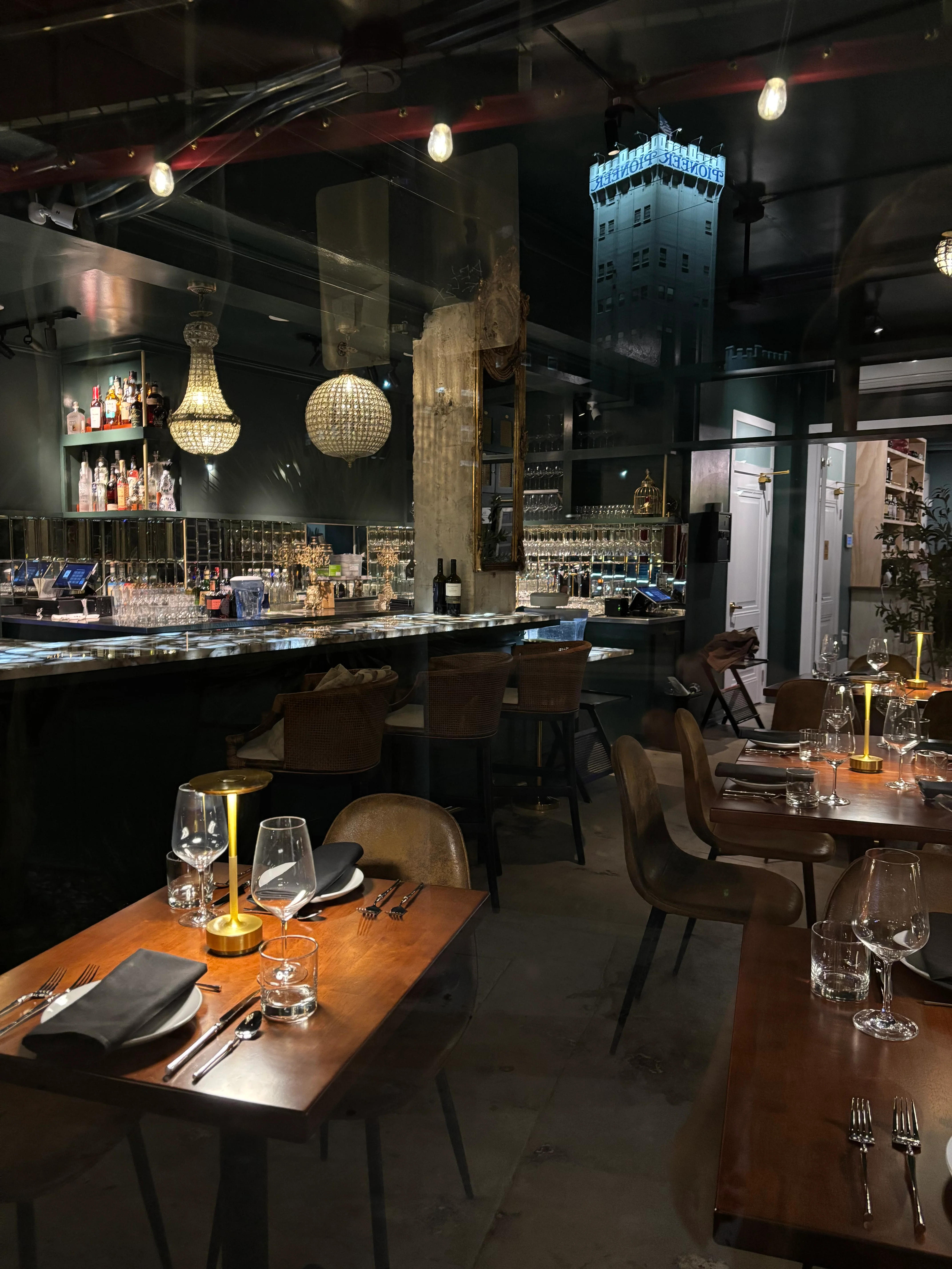 Elegant restaurant interior with bar and city view