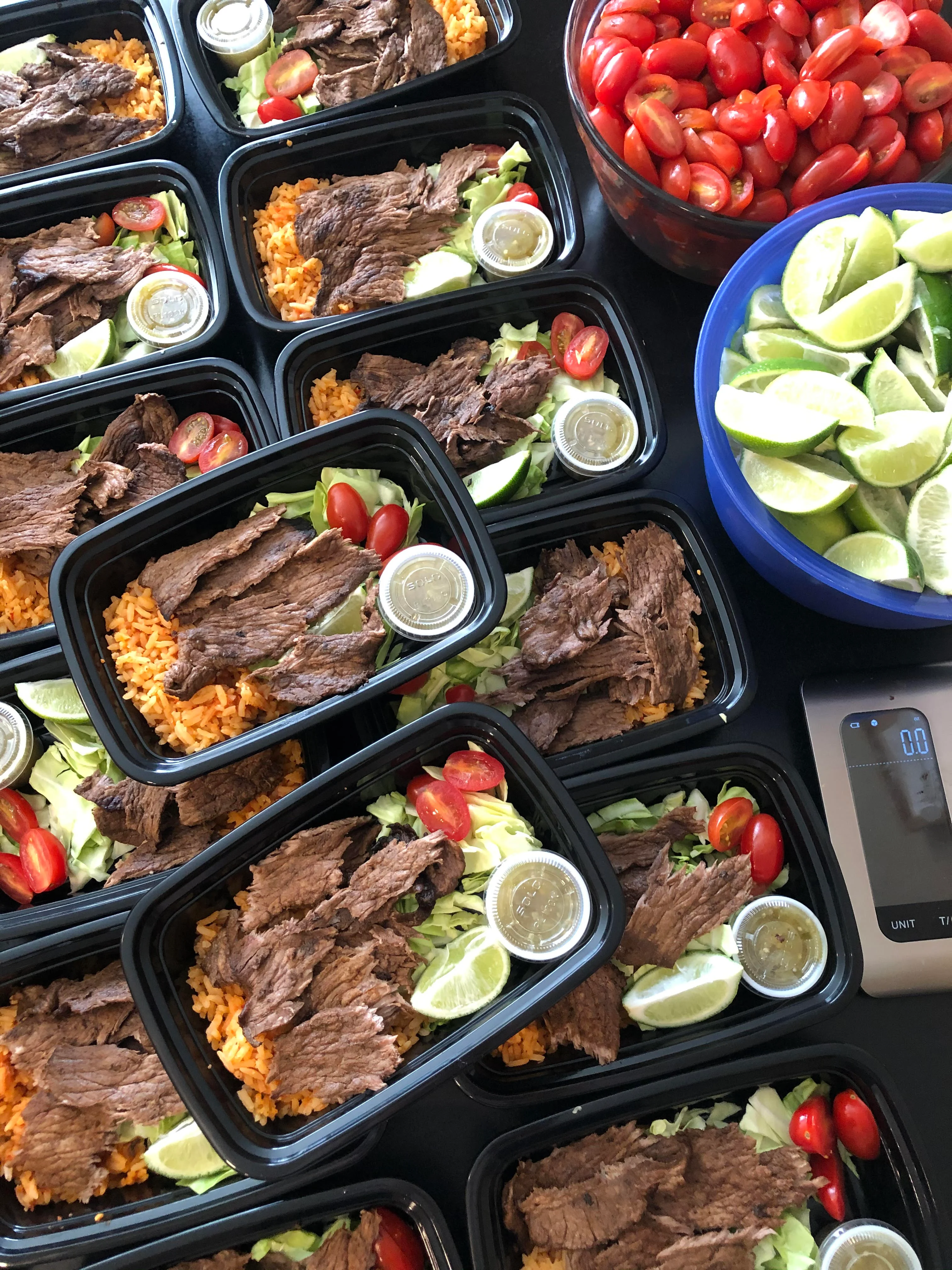 Mexican carne asada meal prep with rice and fresh toppings