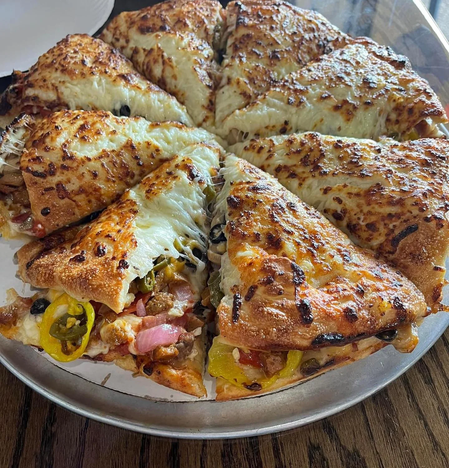 Cheesy stuffed crust pizza with assorted toppings