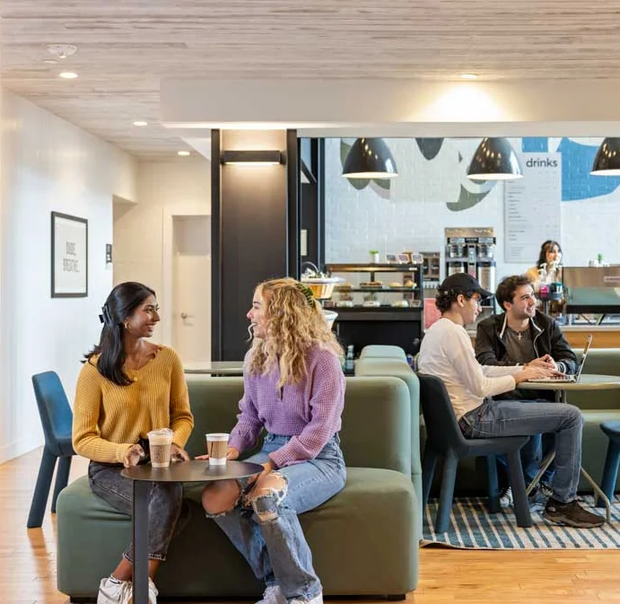 Friends enjoying coffee in coffee shop