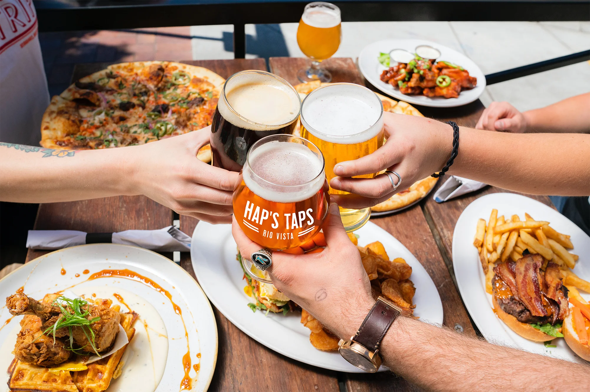 Cheers with craft beers and comfort food at a lively restaurant