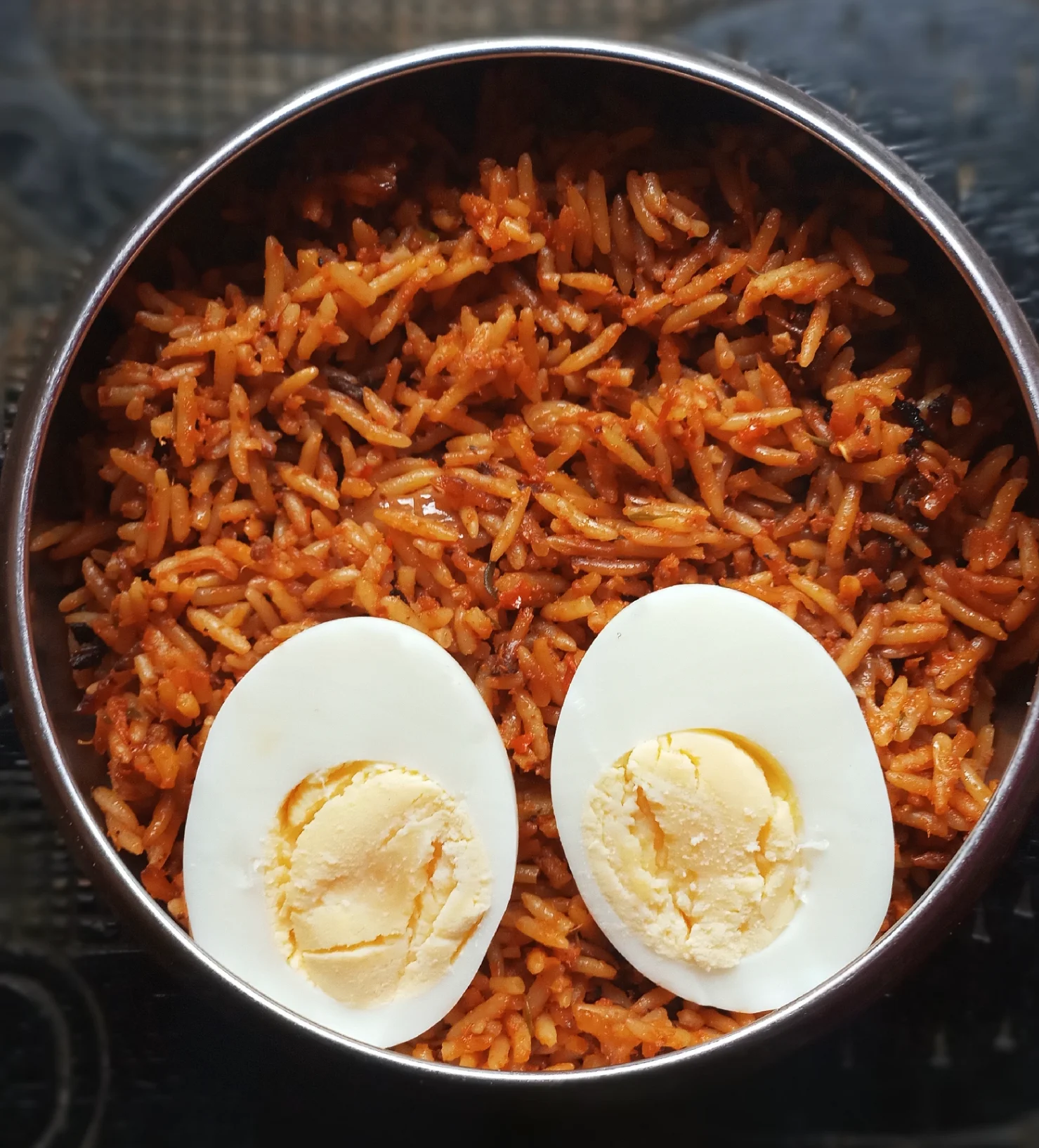 Jollof Rice in a pot with egg