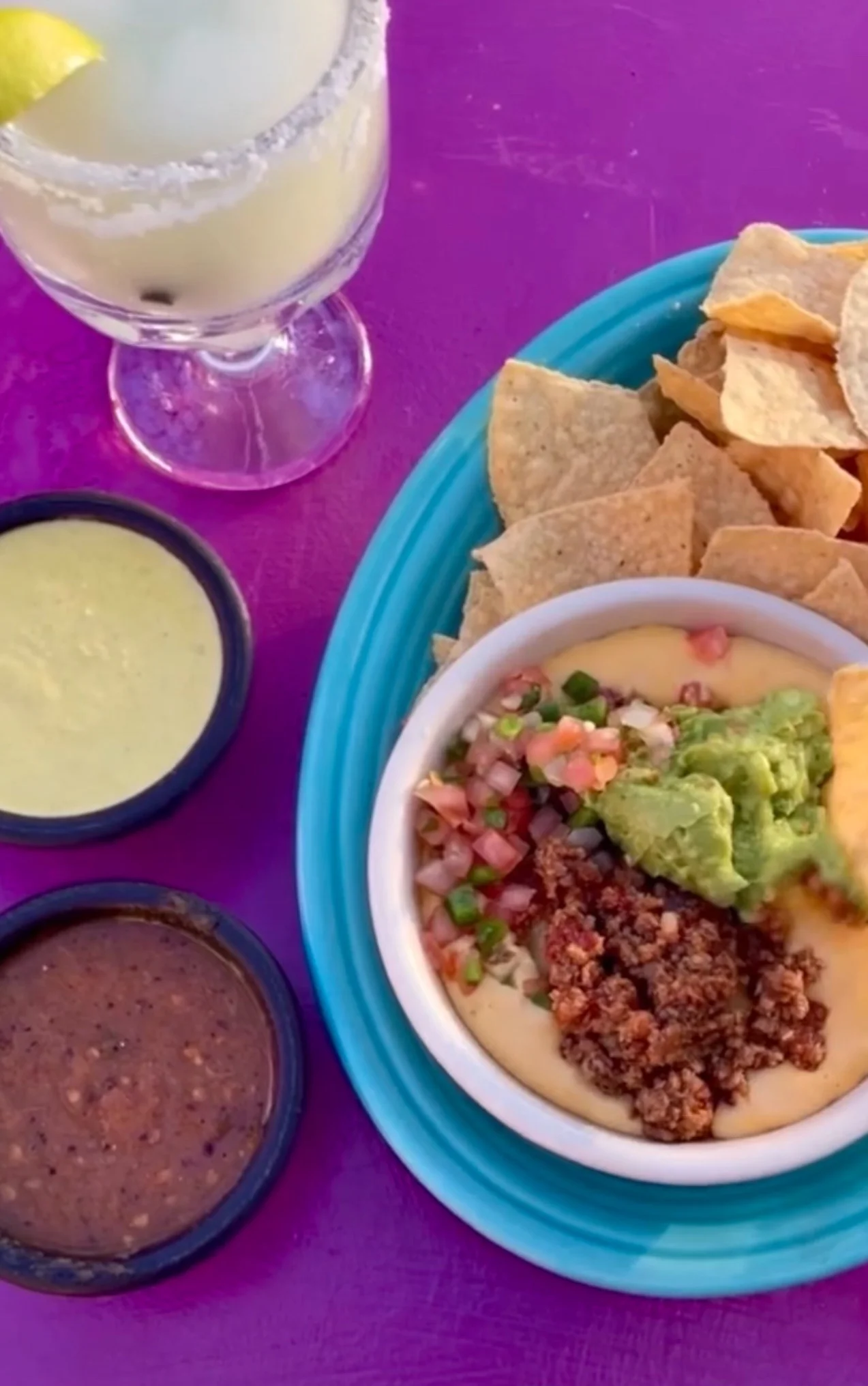 Loaded nachos with guacamole and salsa