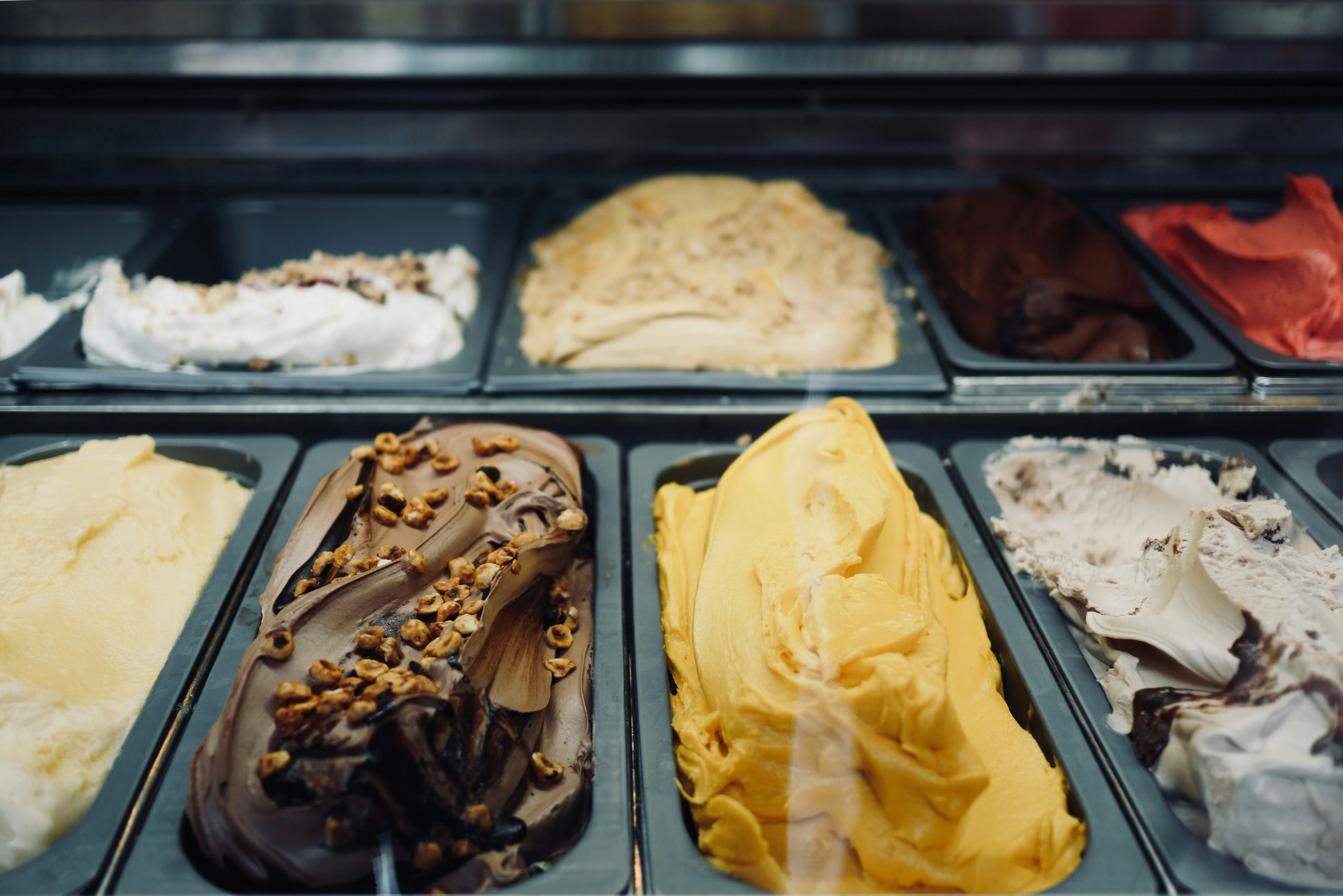 Assorted gelato flavors in a display case
