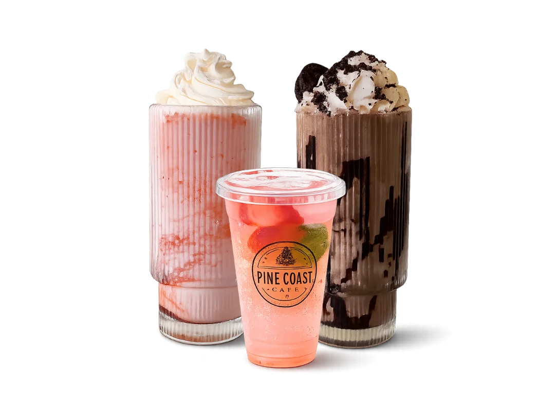 Chocolate milkshake topped with whipped cream and cookie crumbles