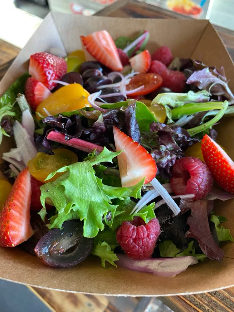 Delicious gourmet burger with fresh toppings on a wooden table