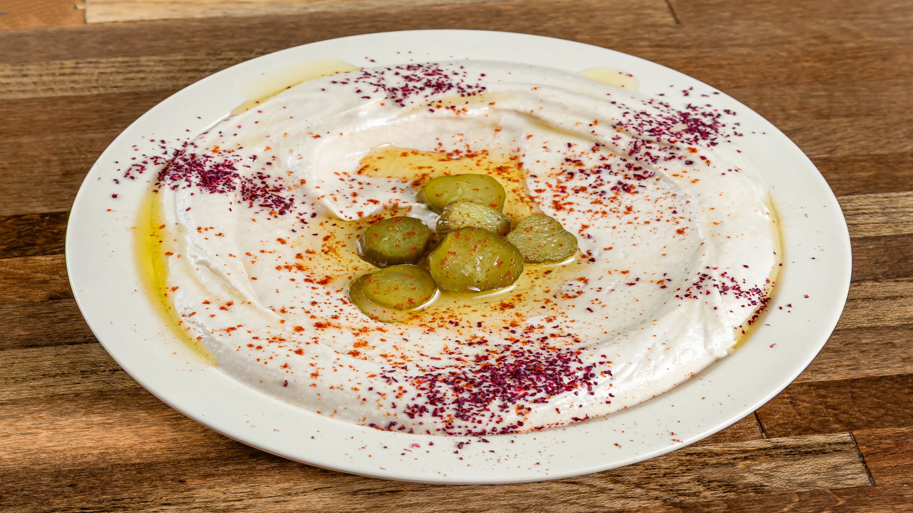 Pita Zone hummus with olive oil, spices and pickles