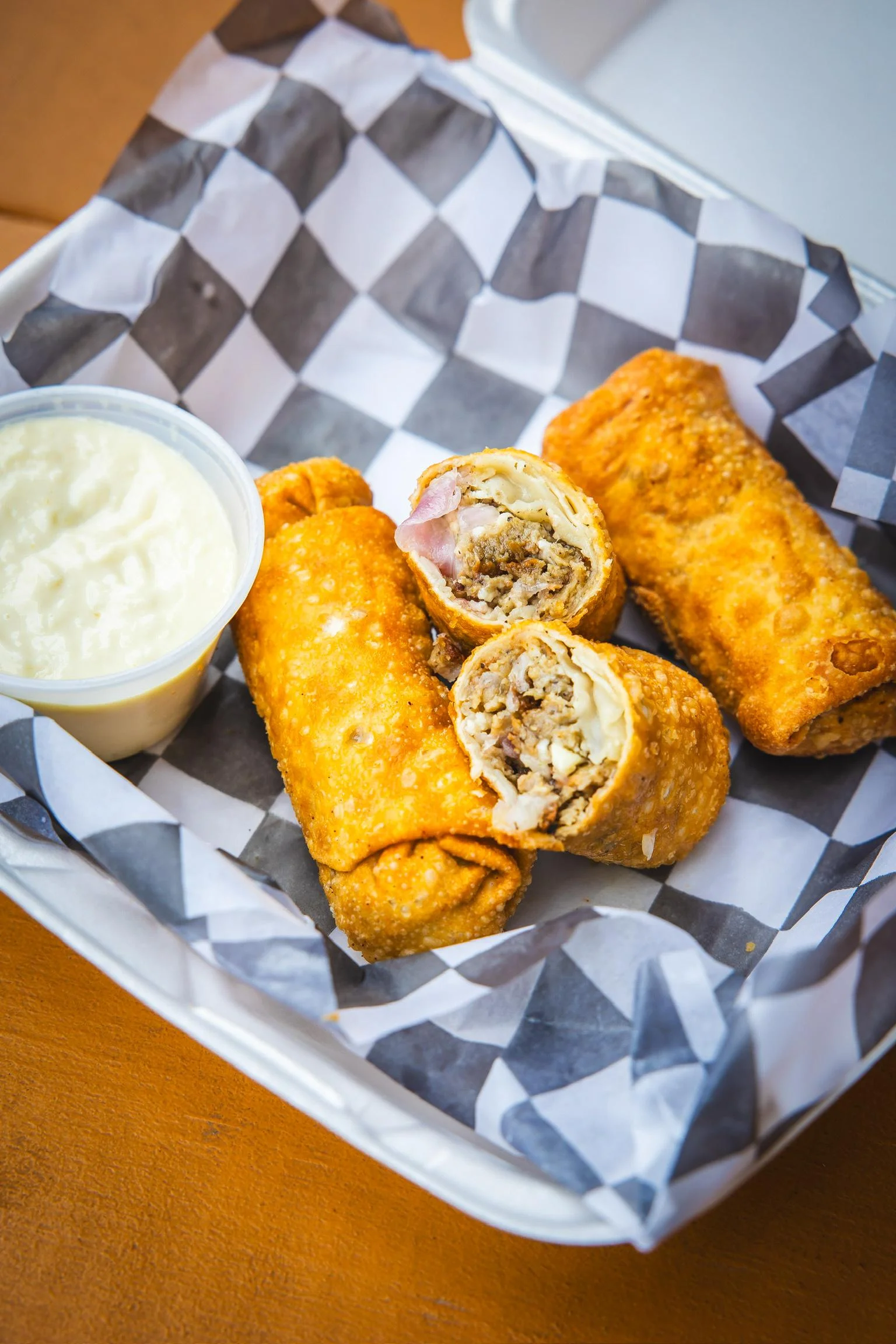 Greek gyro eggrolls with garlic aioli dipping sauce at Stuffed Burritos in San Antonio