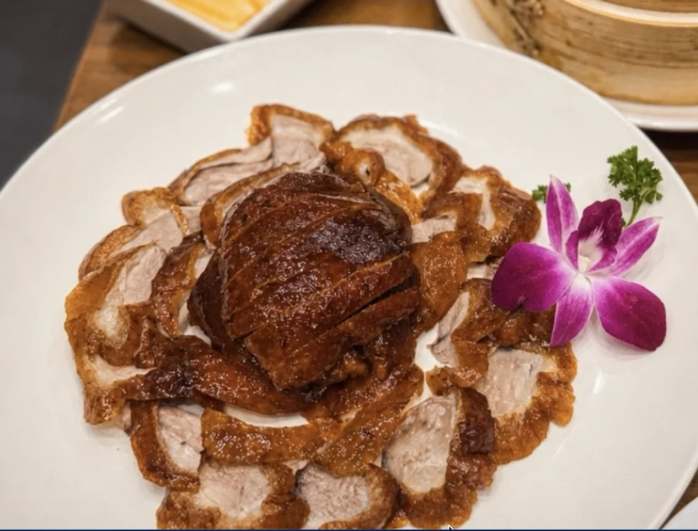 Signature Peking Duck served with pancakes and garnishes