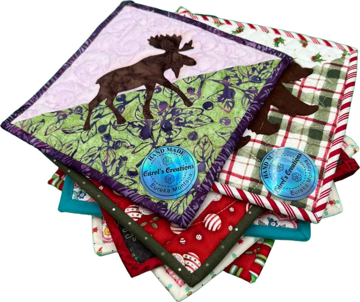 Colorful handmade quilted pot holders with nature designs
