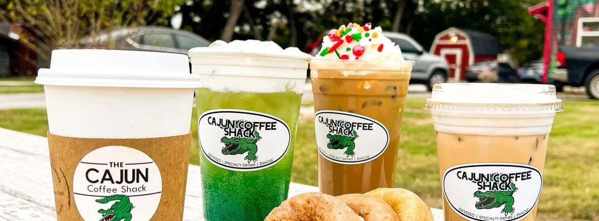 Assorted coffee drinks and donuts from a Cajun coffee shop