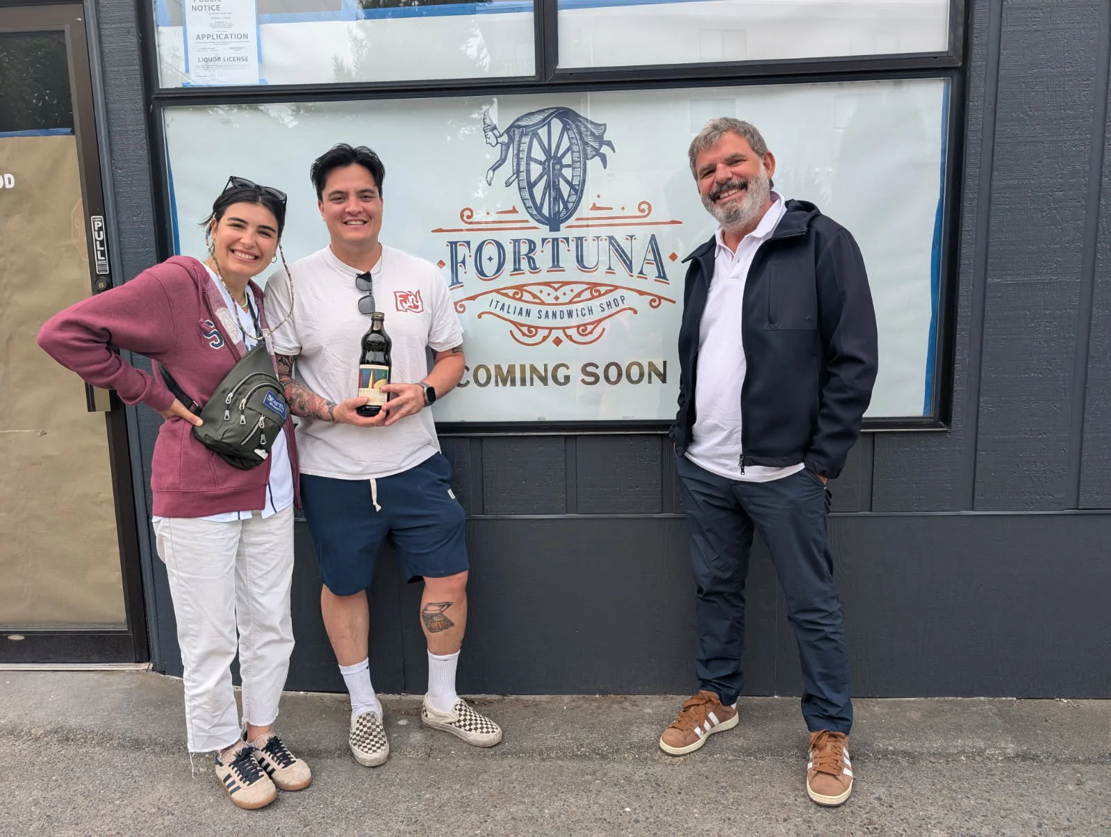 Team celebrating the opening of Fortuna Italian Sandwich Shop