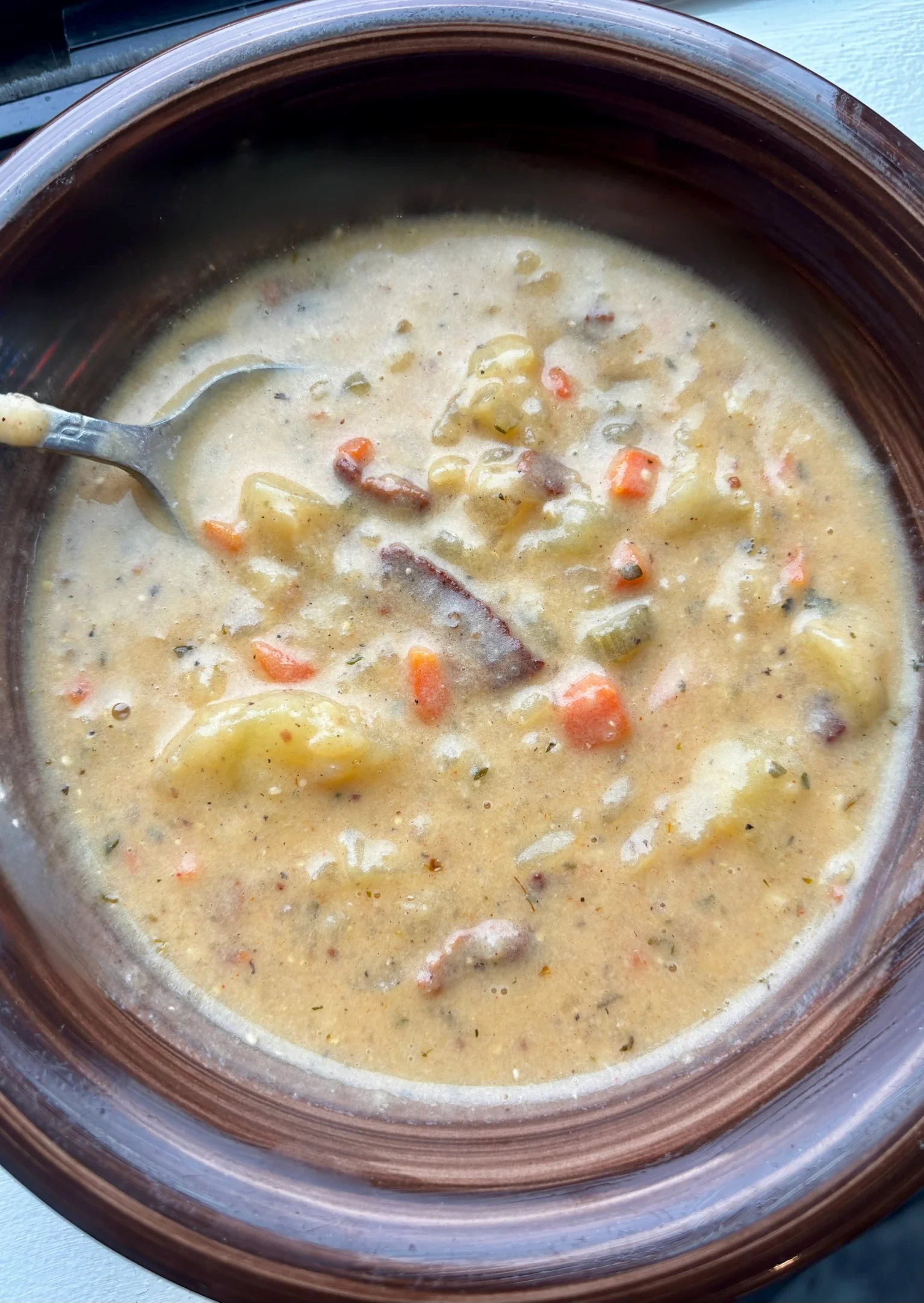Creamy New England clam chowder in a rustic bowl