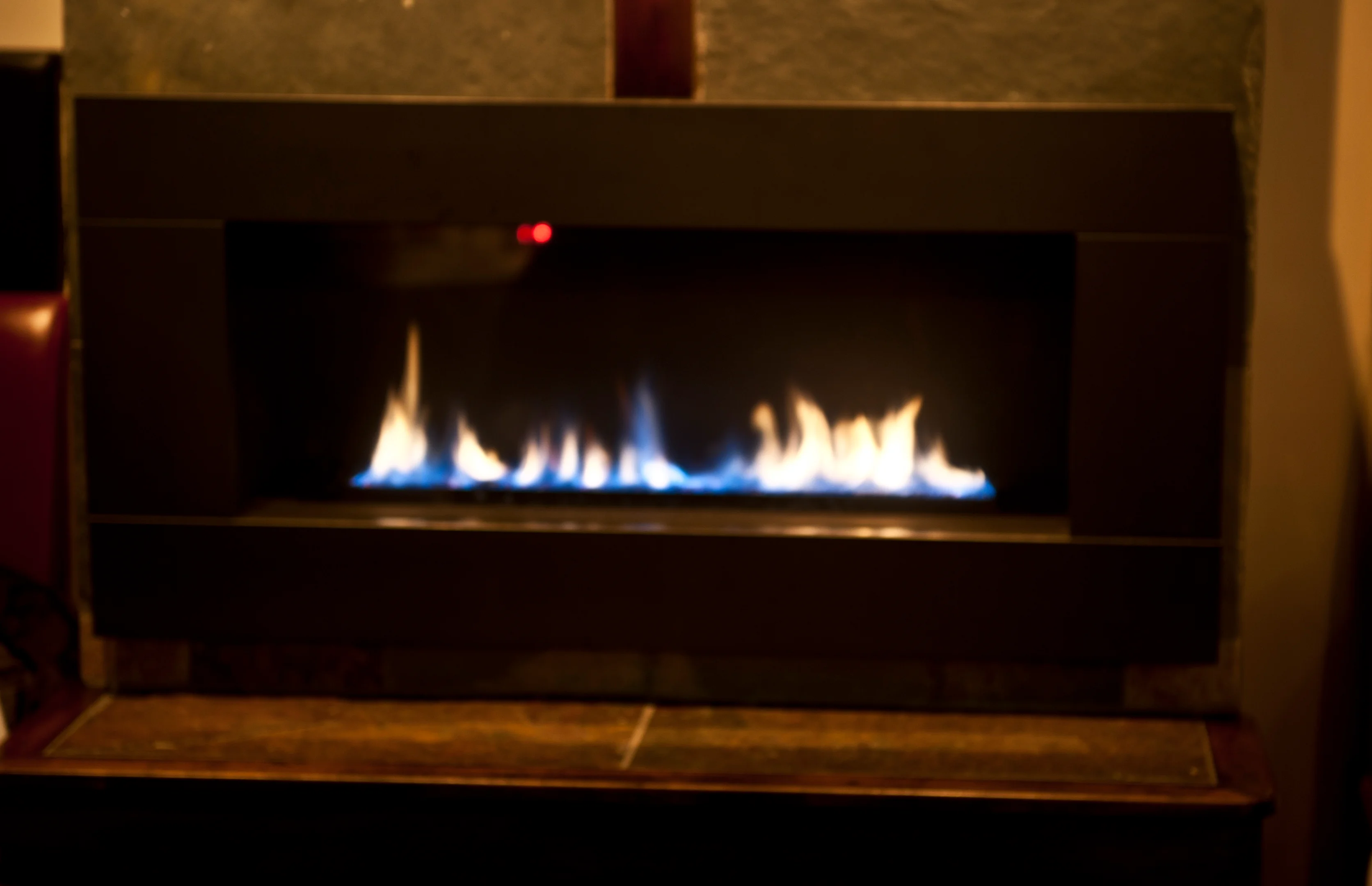 Modern gas fireplace in a cozy restaurant setting