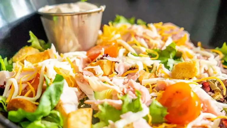 Salad with croutons and tomatoes