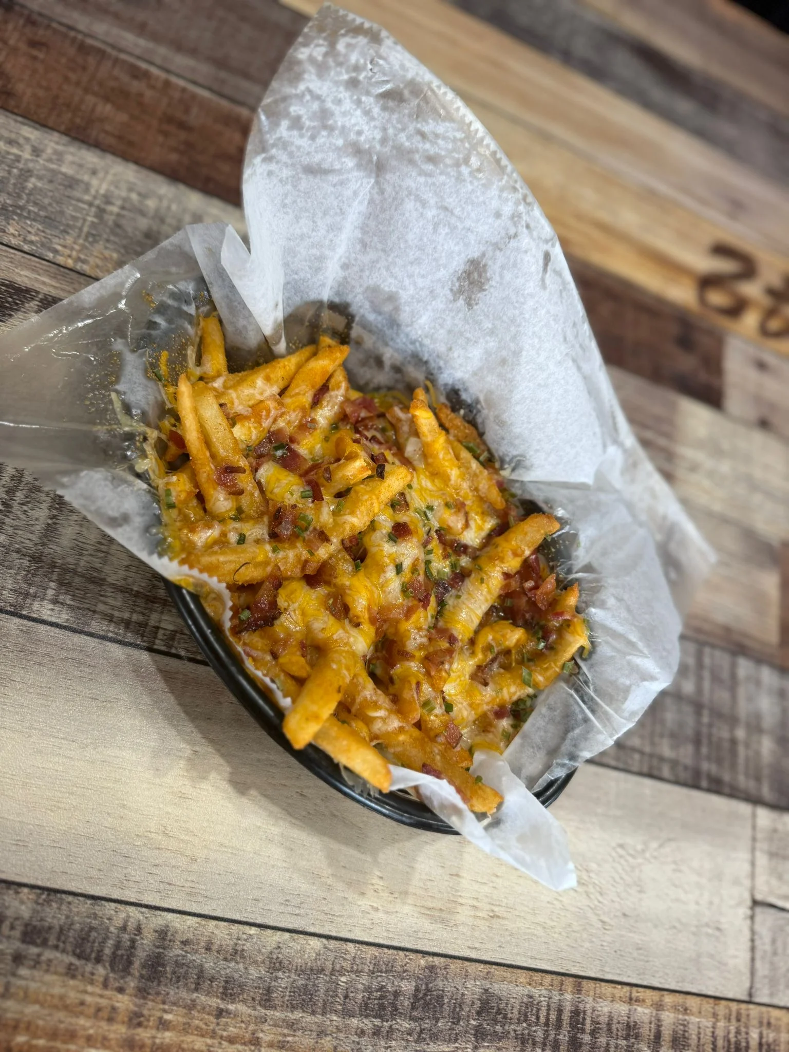 Loaded cheese fries topped with bacon