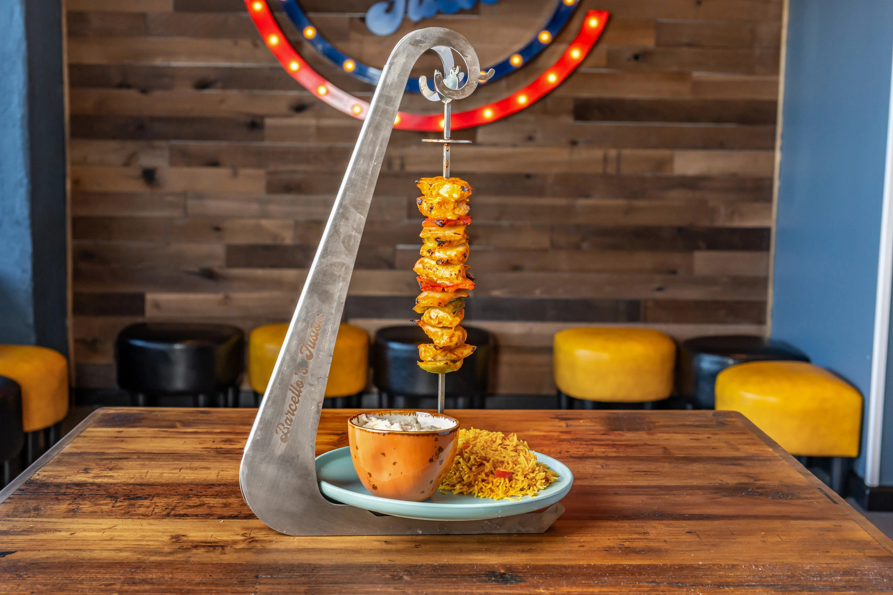 Indian chicken tikka skewers with rice and sauce