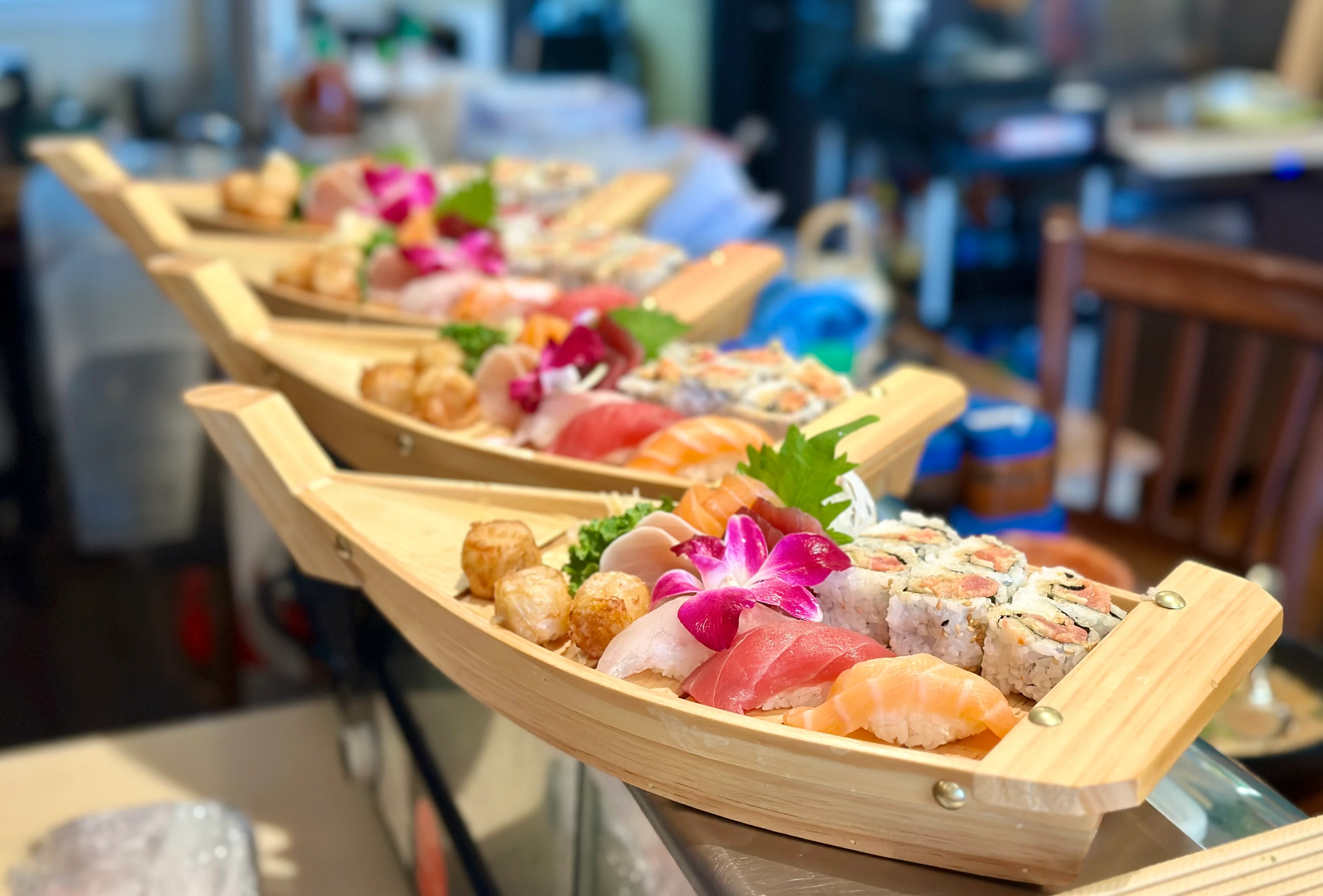Japanese sushi boat platter with assorted sashimi and rolls