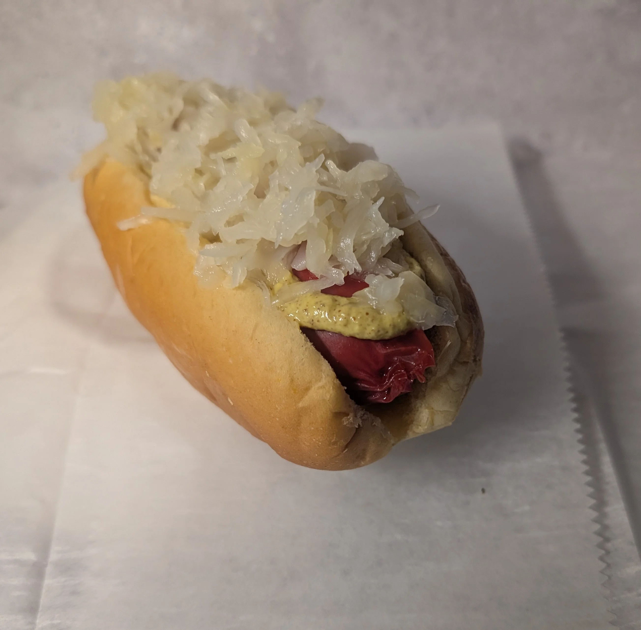 Classic German hot dog with sauerkraut and mustard