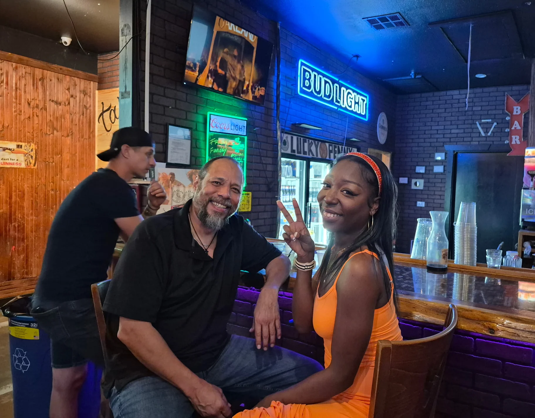 Vibrant bar scene with patrons enjoying drinks and conversation