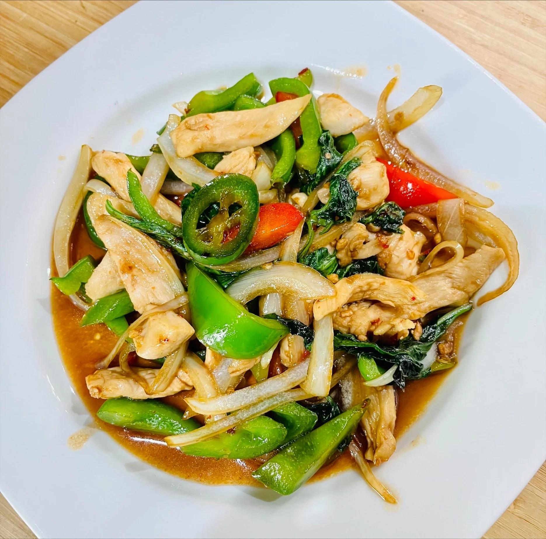 Thai basil chicken stir-fry with colorful vegetables