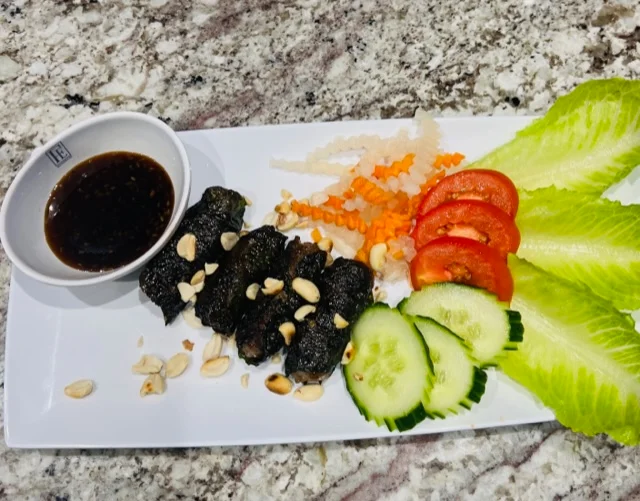 Vietnamese fresh spring rolls with dipping sauce and fresh vegetables