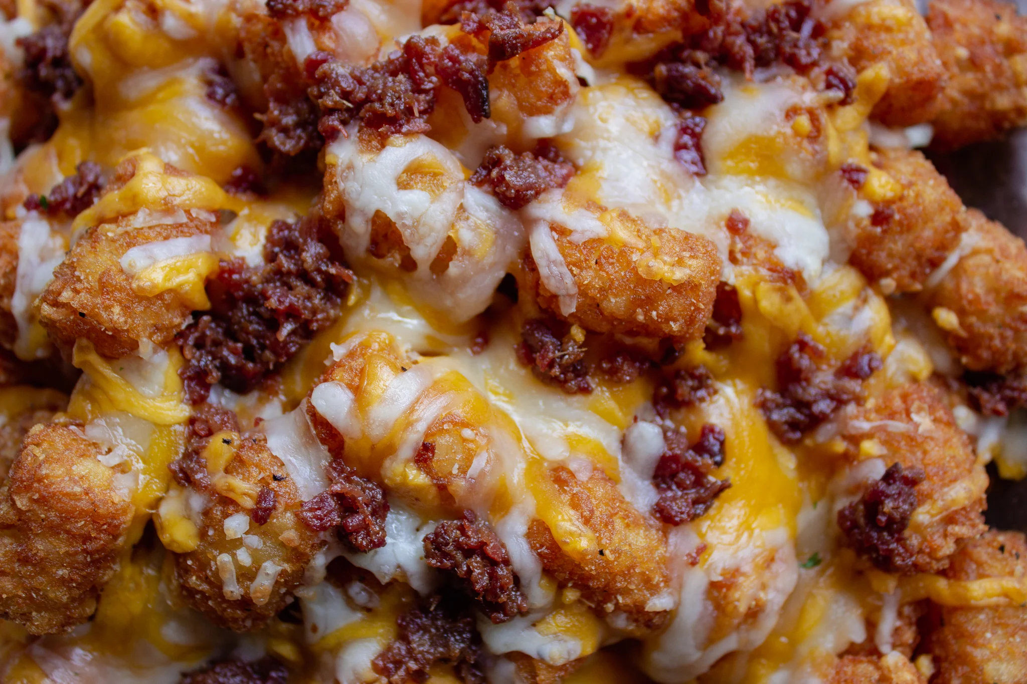 Loaded Spuds at Main Street Pub Downtown Spartanburg, SC. Enjoy these tater tots covered in bacon and cheese. 