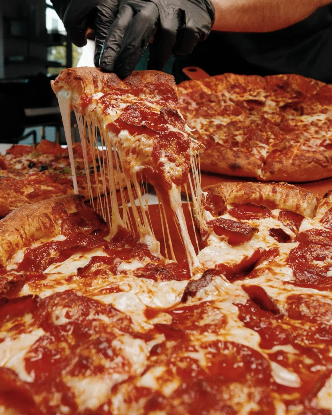 Fresh Zio Al's pizza with melted cheese in Copperfield