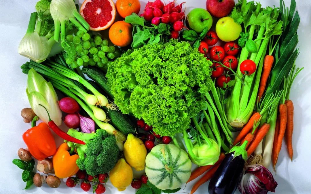 Colorful assortment of fresh vegetables and fruits for healthy cooking