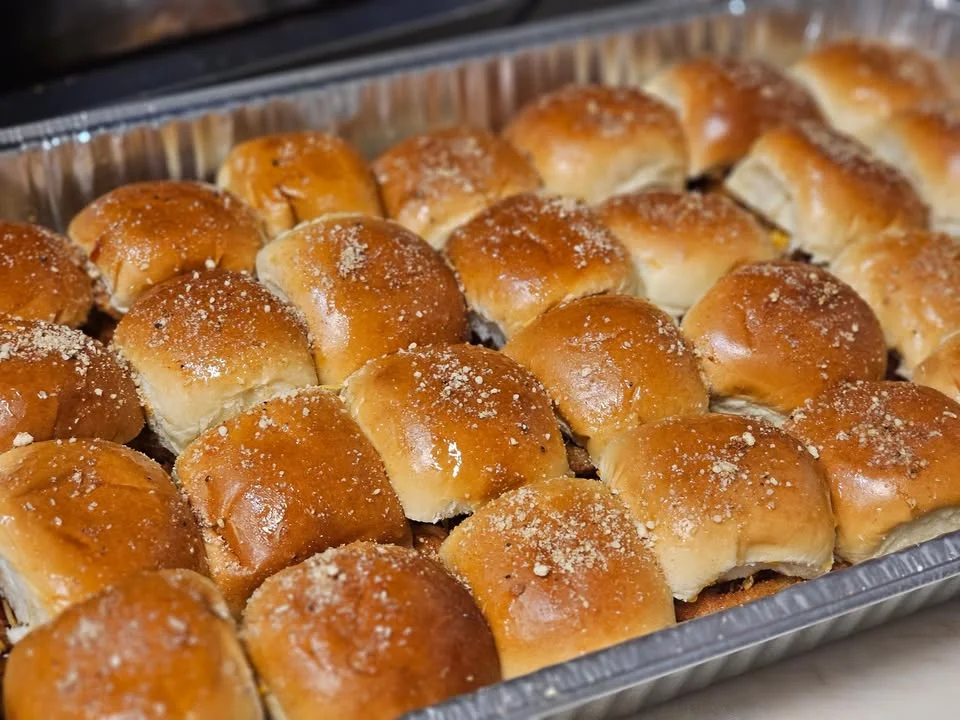 Freshly baked Hawaiian sweet rolls in a tray