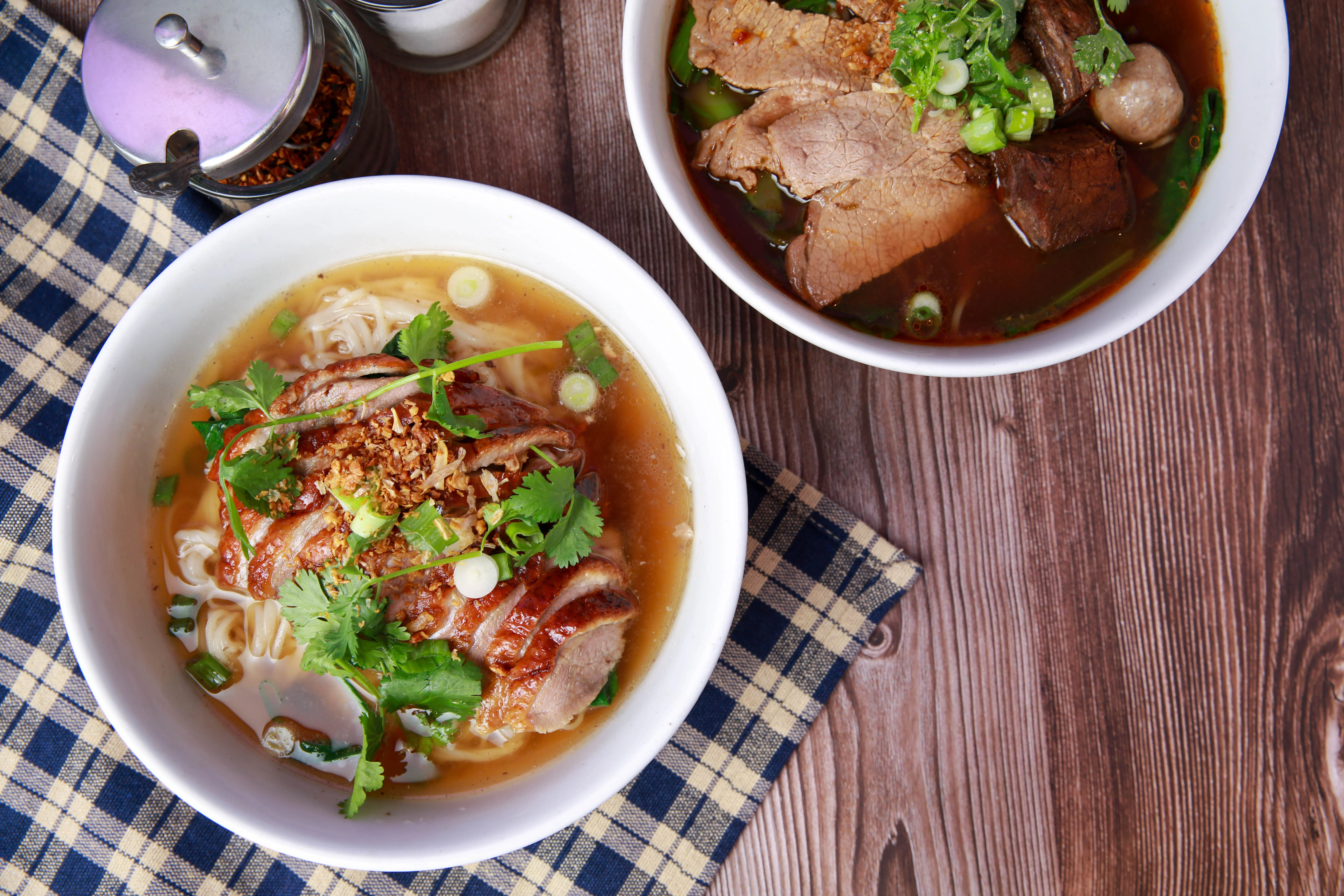 Delicious Thai boat noodles with beef and herbs