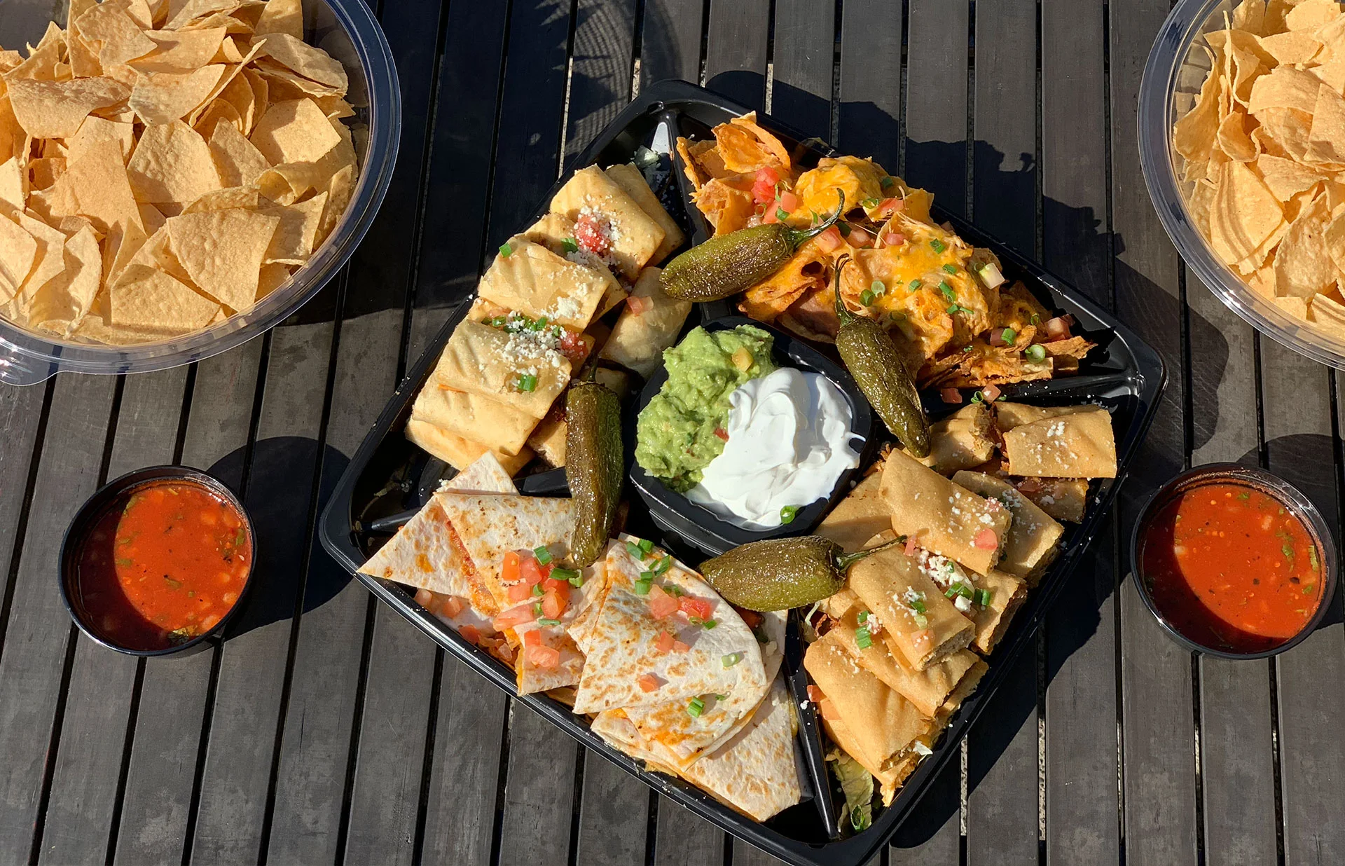 Mexican food catering table with an appetizer platter