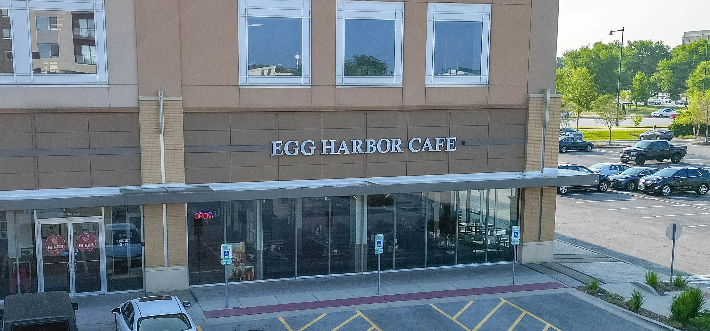 Exterior view of Egg Harbor Cafe with open sign