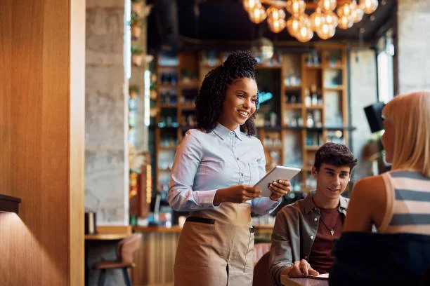 Waitress taking an order in a modern restaurant