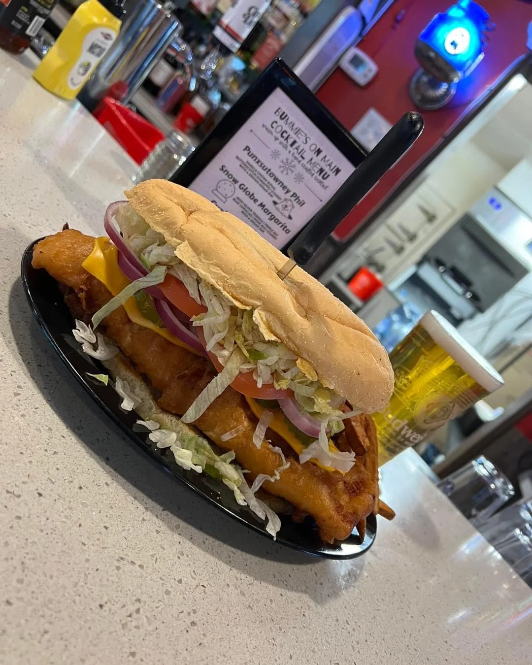 Crispy fish sandwich with fresh toppings