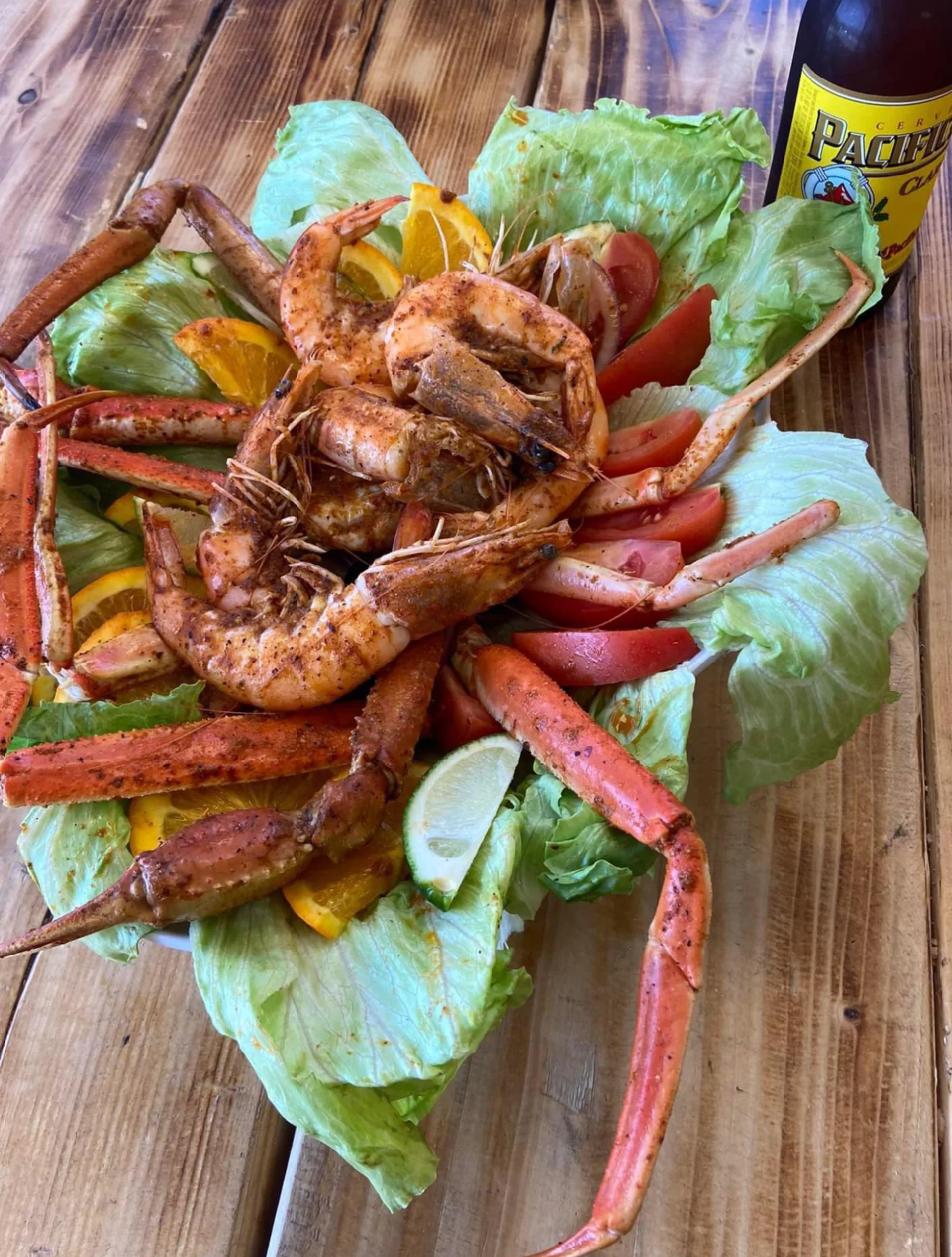Seafood platter featuring shrimp and crab on a bed of lettuce