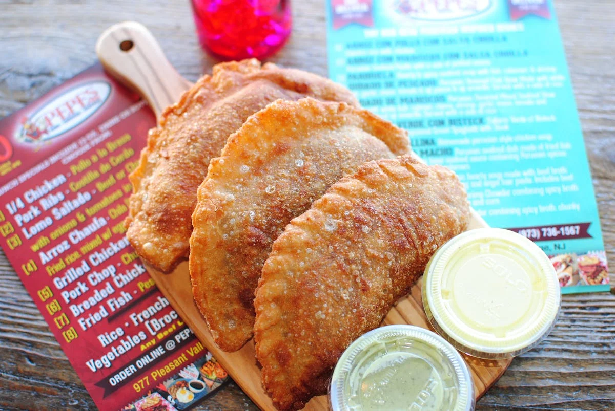 Crispy empanadas served with dipping sauces
