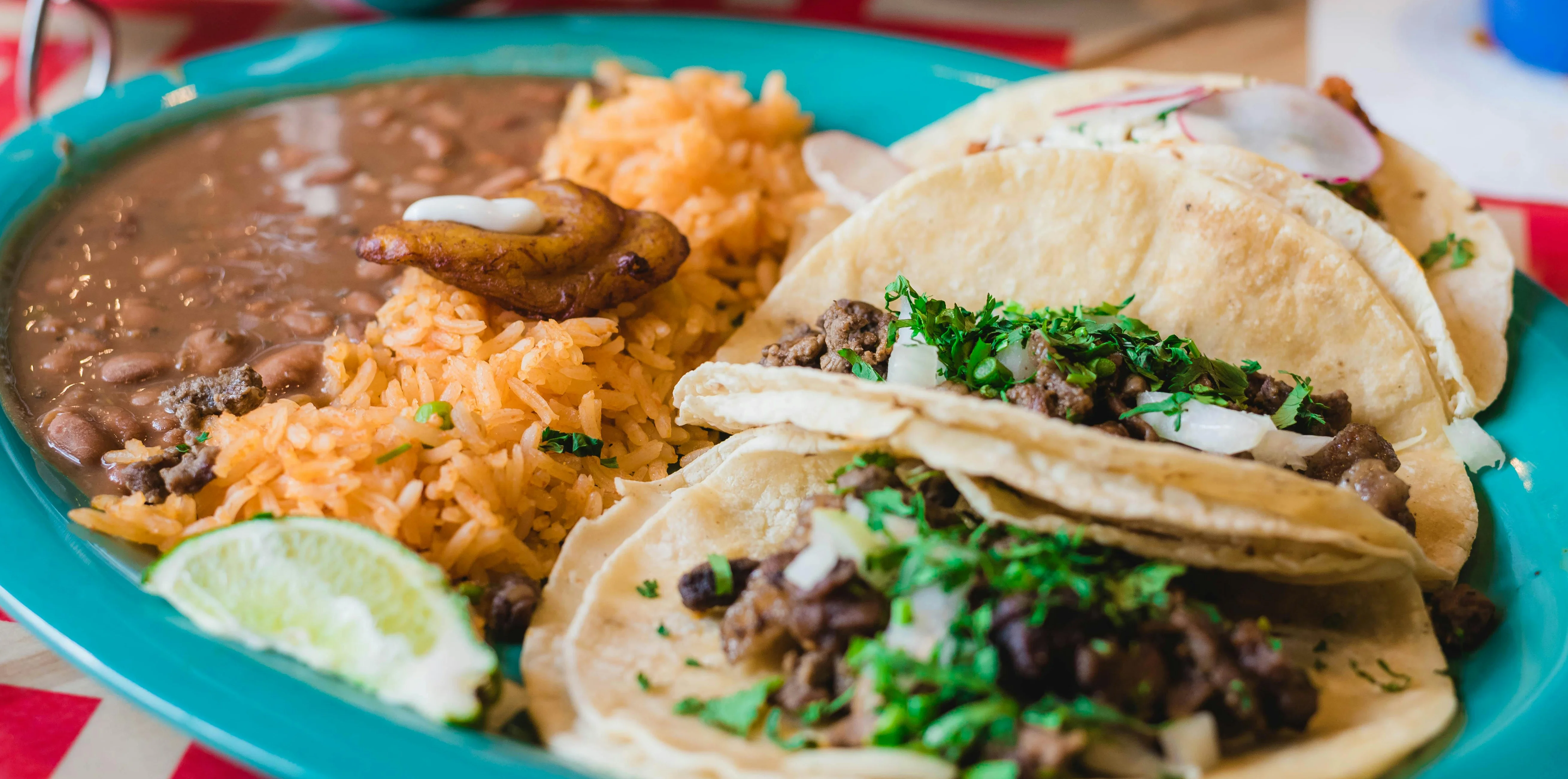 Authentic Mexican tacos with rice and beans