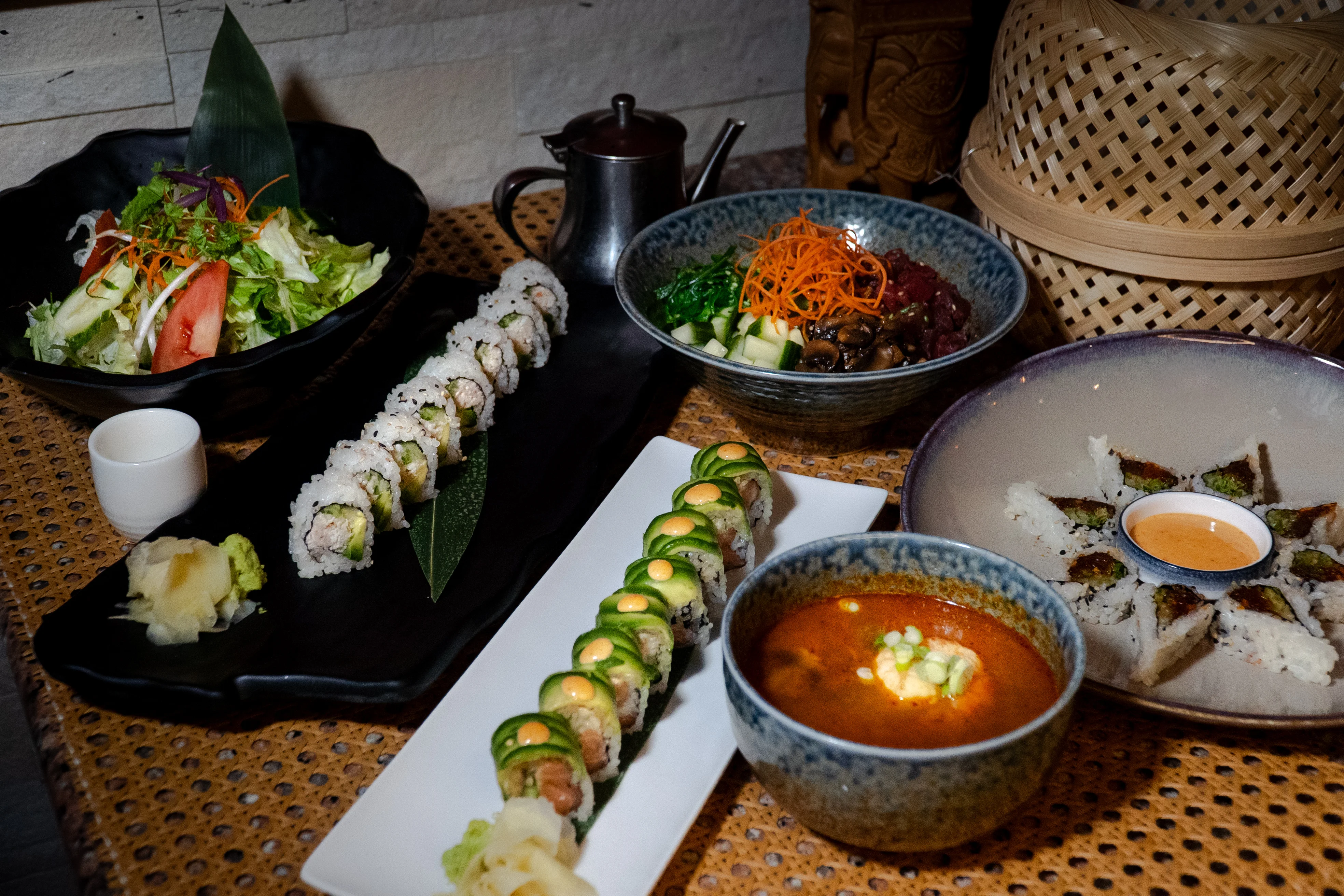 Assorted sushi platter with miso soup and fresh salad