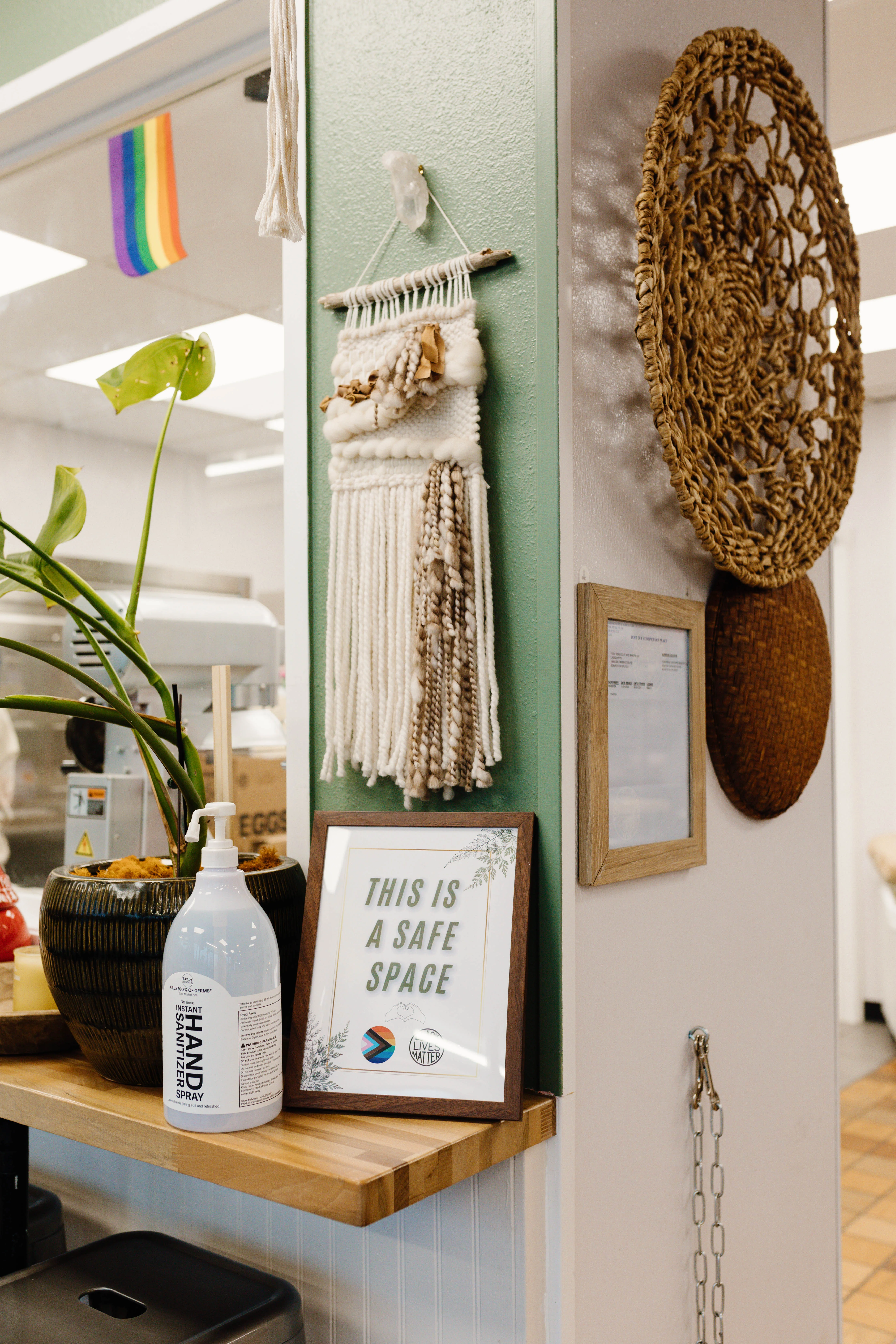 Cozy restaurant corner with decor and hand sanitizer