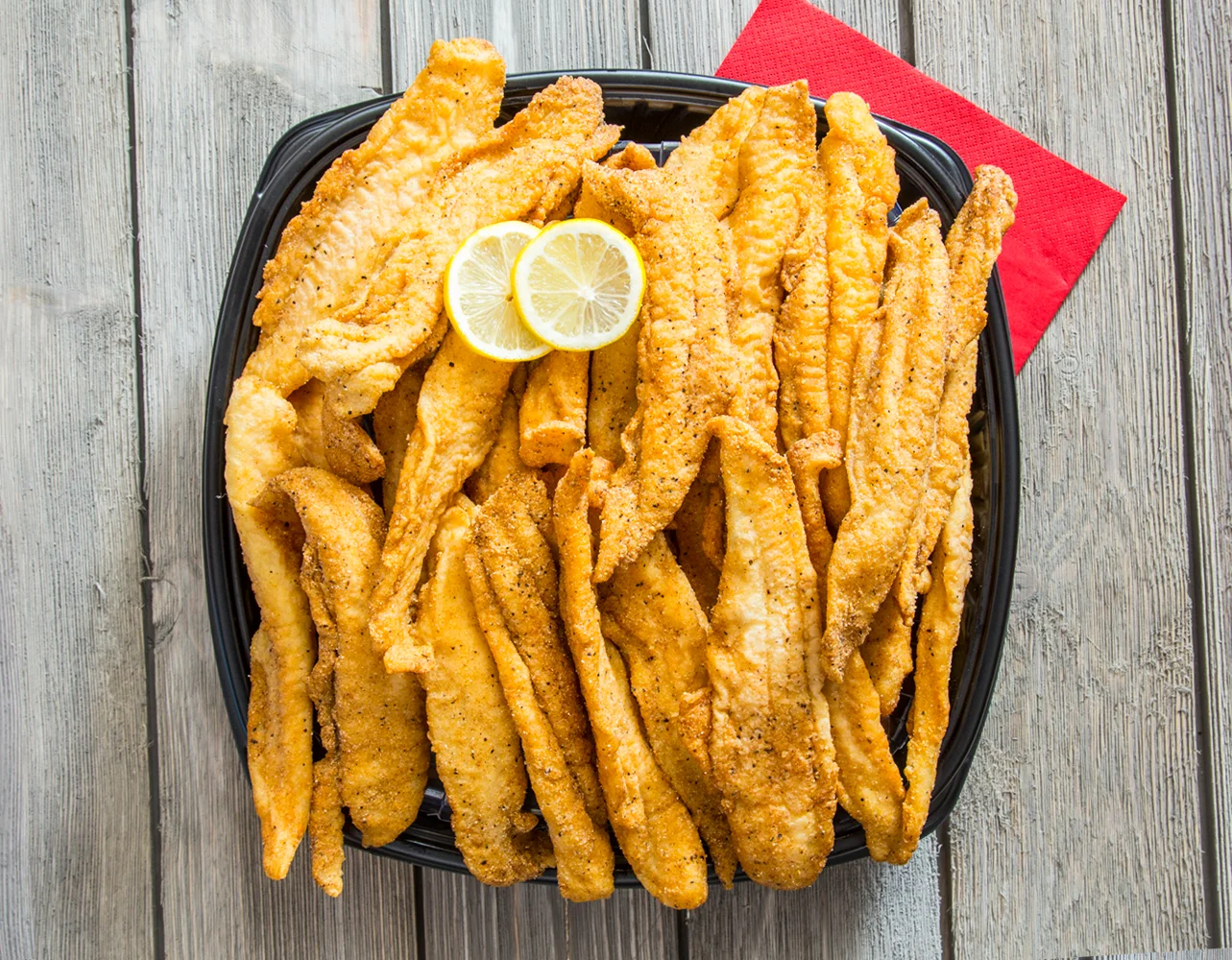 Southern fried catfish fillets with lemon slices