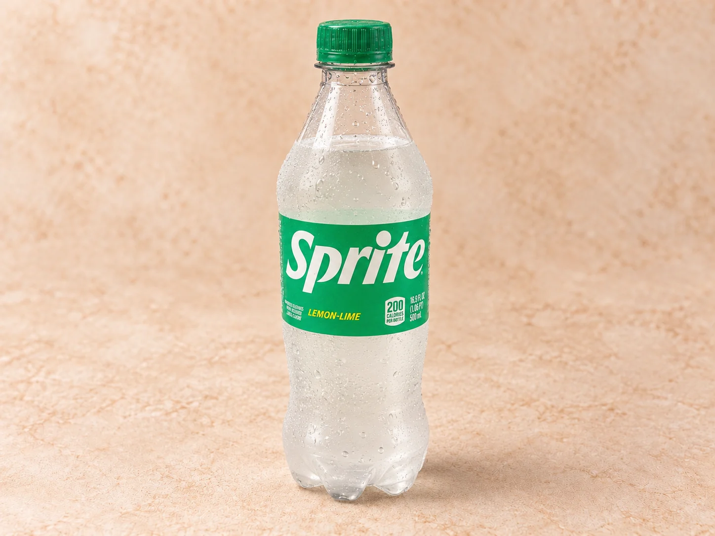 A clear plastic bottle of a lemon-lime flavored carbonated beverage, featuring a green cap and label.