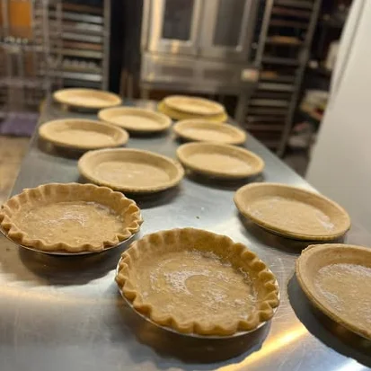 Freshly prepared pie crusts ready for baking