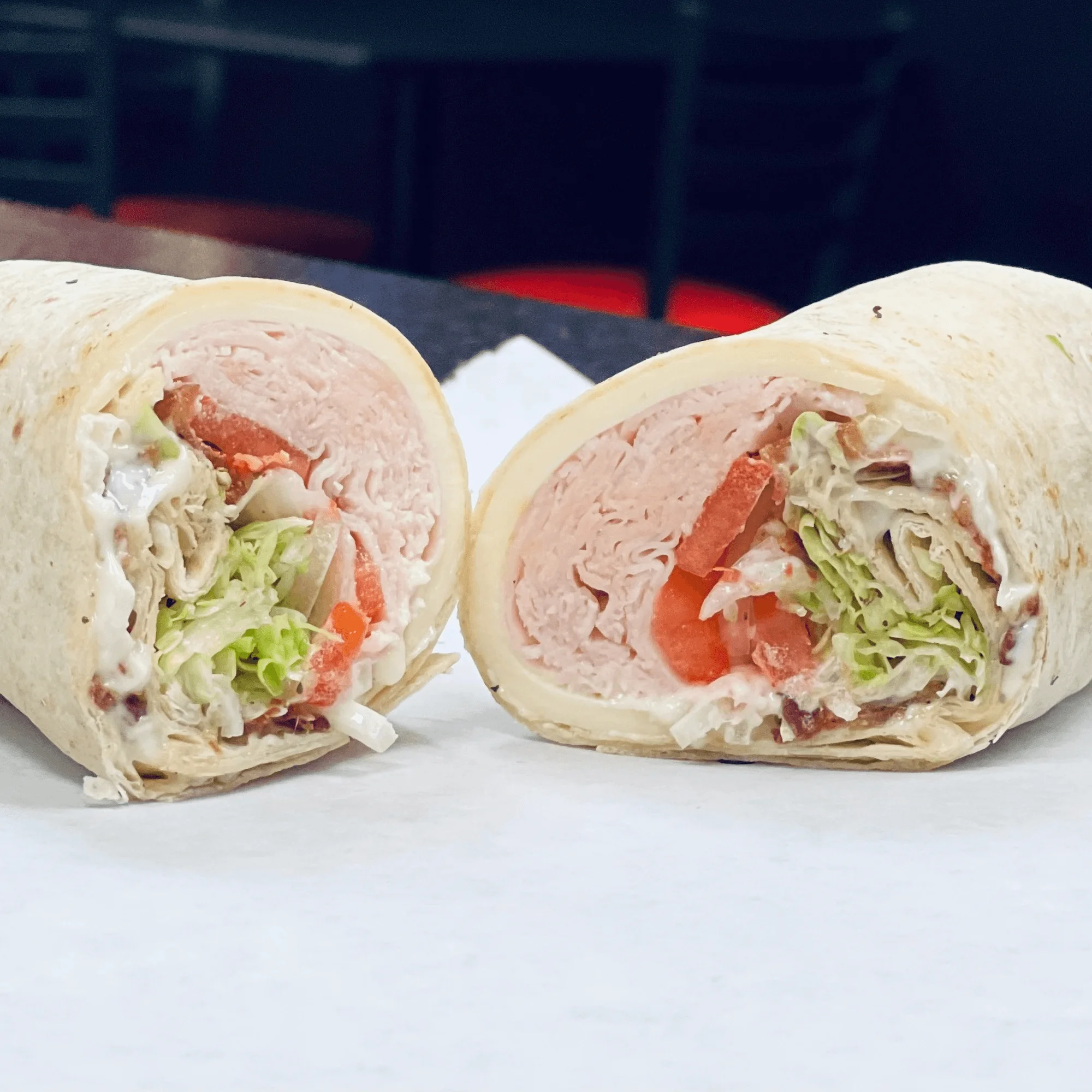 Turkey wrap with lettuce and tomato, a classic deli favorite