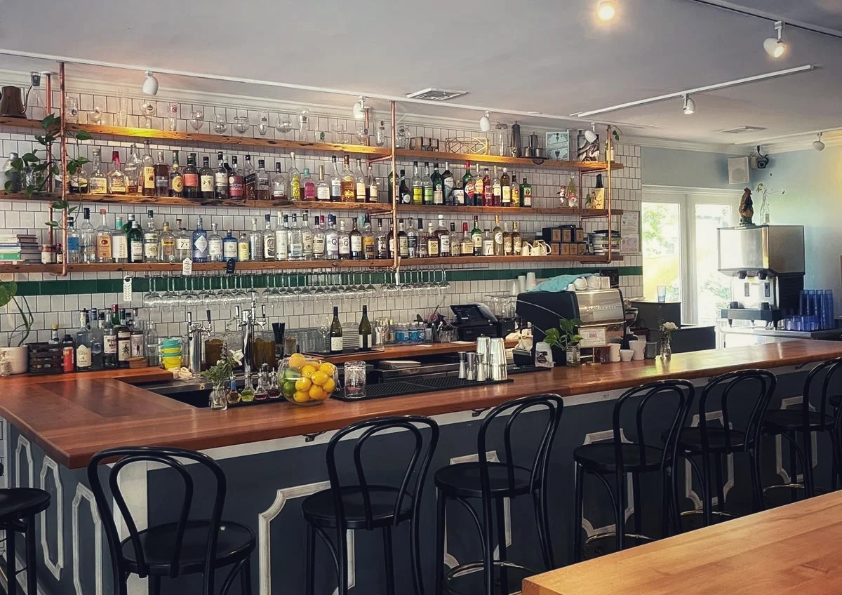 Modern bar interior with a variety of spirits and cocktails