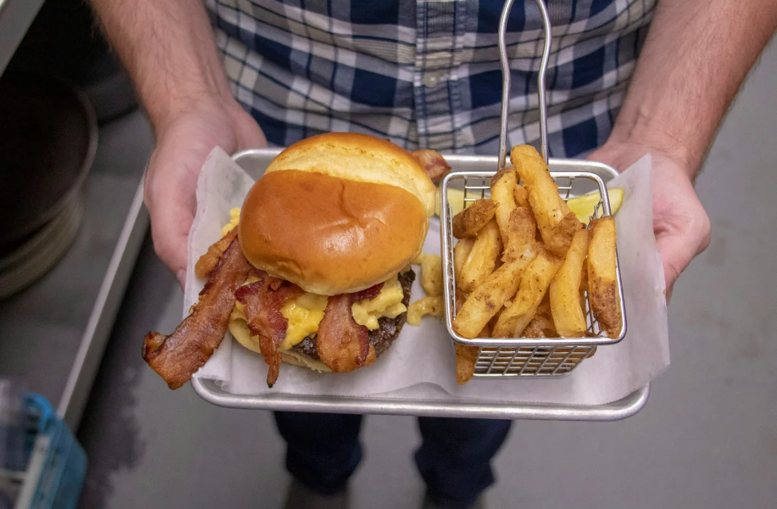 Man Holding Tray of Food
