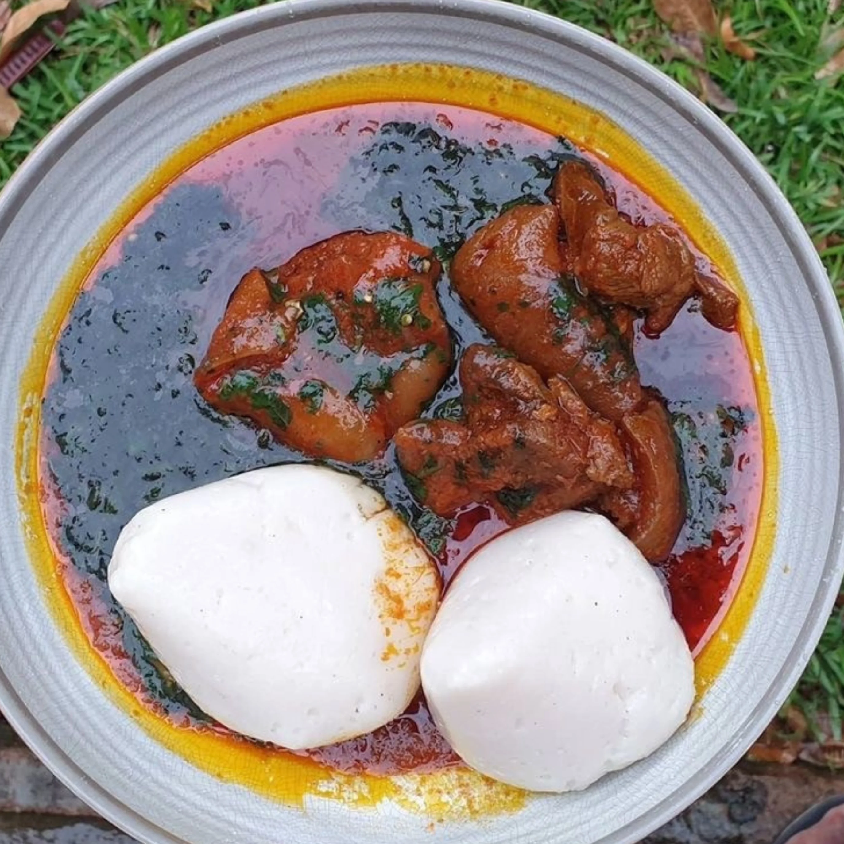 Nigerian egusi soup with pounded yam