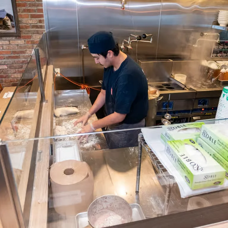 Worker working inside kitchen