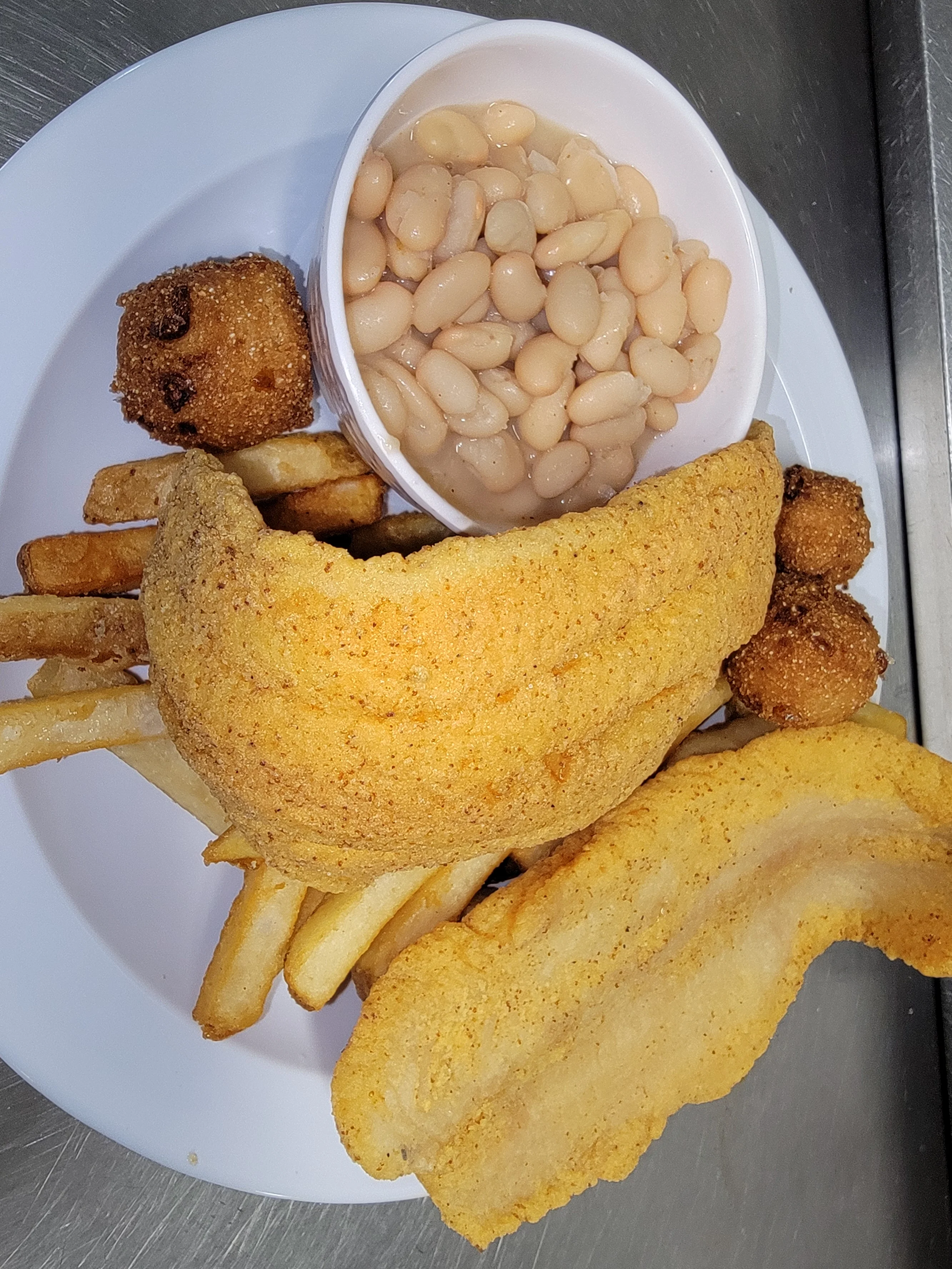 Southern-style fried catfish with fries and white beans